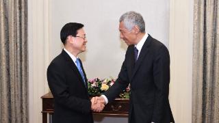 李家超访问新加坡与李显龙会面，冀港新两地合作稳步发展